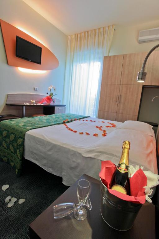 Postel nebo postele na pokoji v ubytování Hotel Sorriso