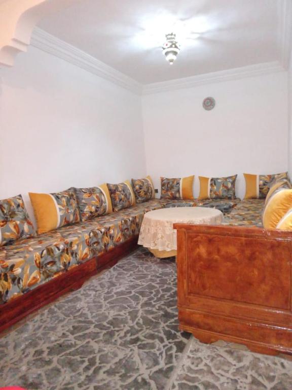 a living room with a couch and a table at Edibesaadia in Essaouira