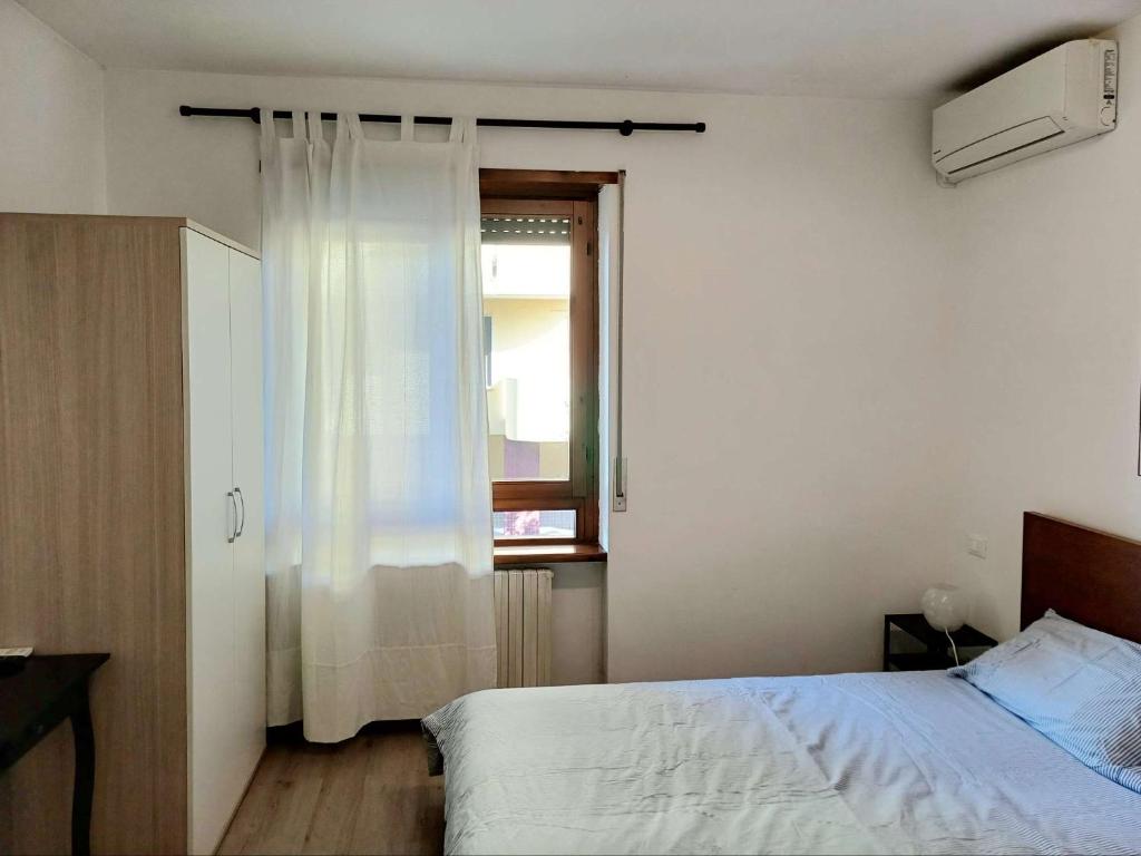 Postel nebo postele na pokoji v ubytování Nottetempo Verona