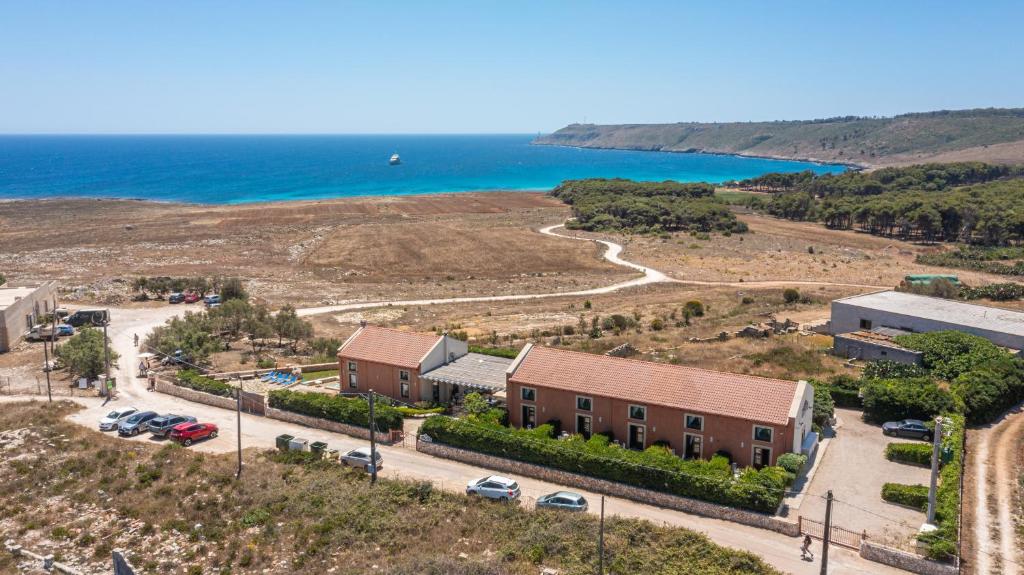 an aerial view of a building next to the ocean at Palascìa Wellness Relais in Otranto