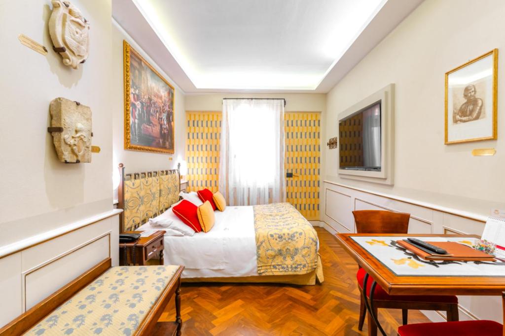 Posteľ alebo postele v izbe v ubytovaní Art Hotel Commercianti