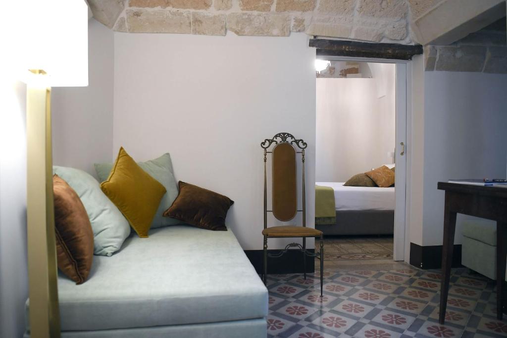 Postel nebo postele na pokoji v ubytování Palazzo Guido