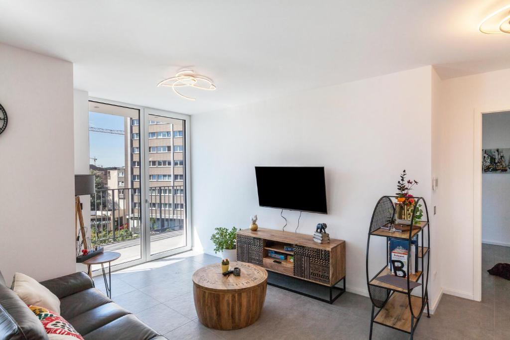 TV a/nebo společenská místnost v ubytování Modern, Cityview, Penthouse Yiwoo