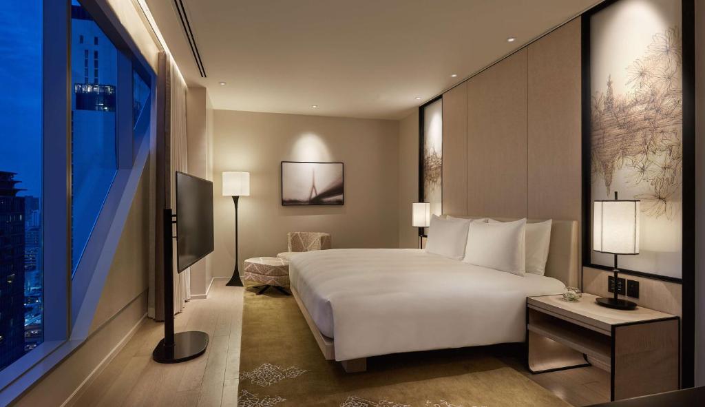 Postel nebo postele na pokoji v ubytování Park Hyatt Bangkok