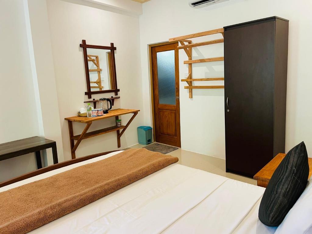 Postel nebo postele na pokoji v ubytování Wild Resort Ella