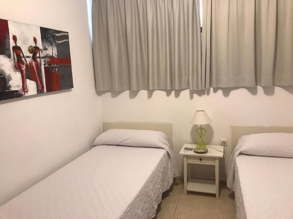 Postel nebo postele na pokoji v ubytování Apartamentos Quintero – Adults Only