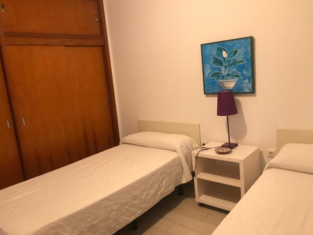 Postel nebo postele na pokoji v ubytování Apartamentos Quintero – Adults Only