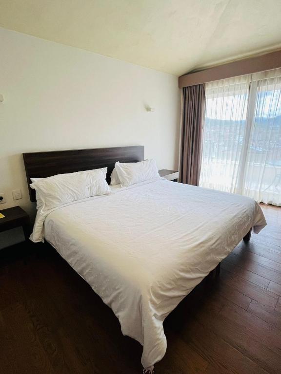 Postel nebo postele na pokoji v ubytování Hotel Casa Rubio
