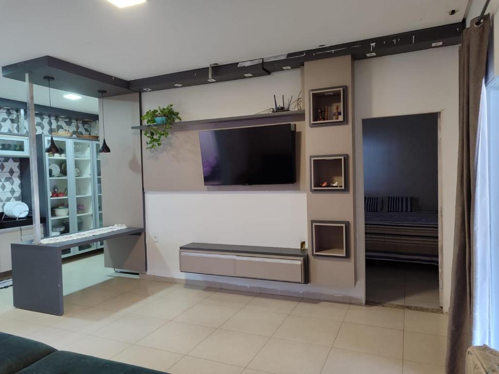 Et tv og/eller underholdning på Recanto João E Maria