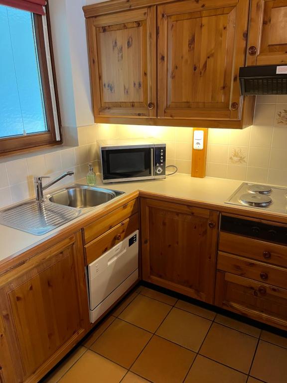 Kuchyň nebo kuchyňský kout v ubytování Apartment Gerlitzen