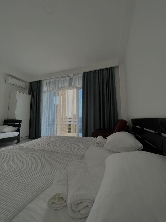 Llit o llits en una habitació de Kolkhi Guest House