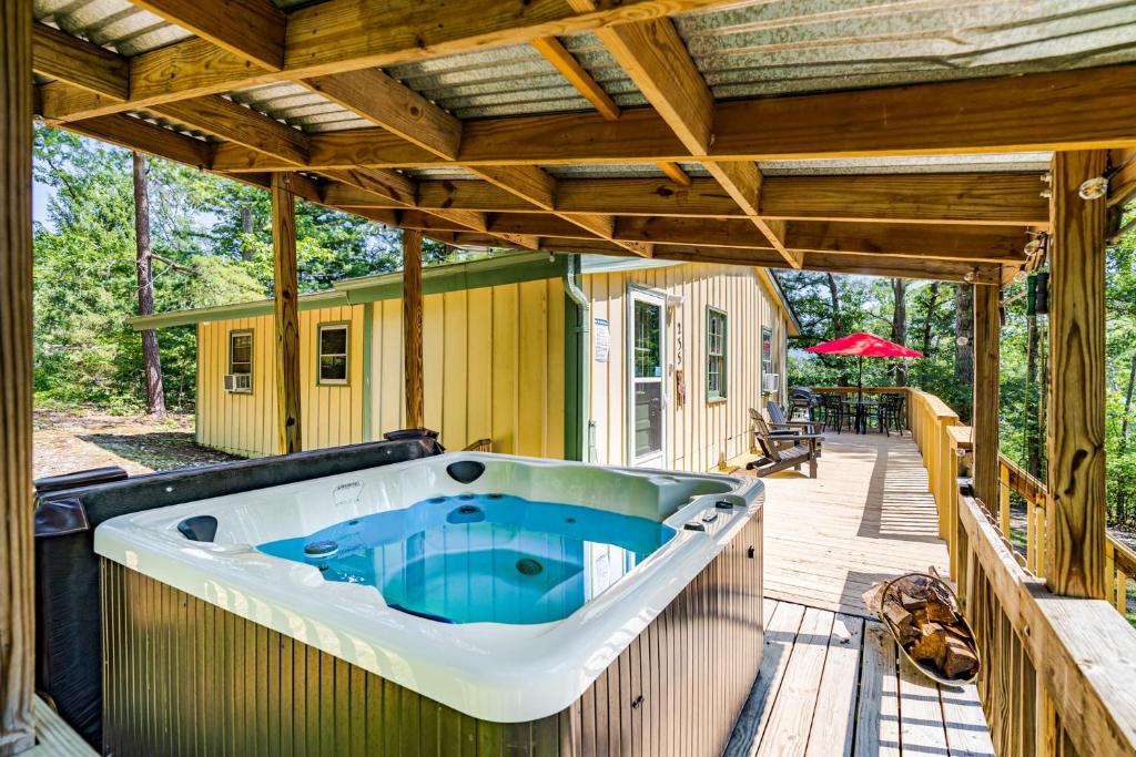 River Access Cabin w Hot Tub, Deck, Grill, & Wifi photo