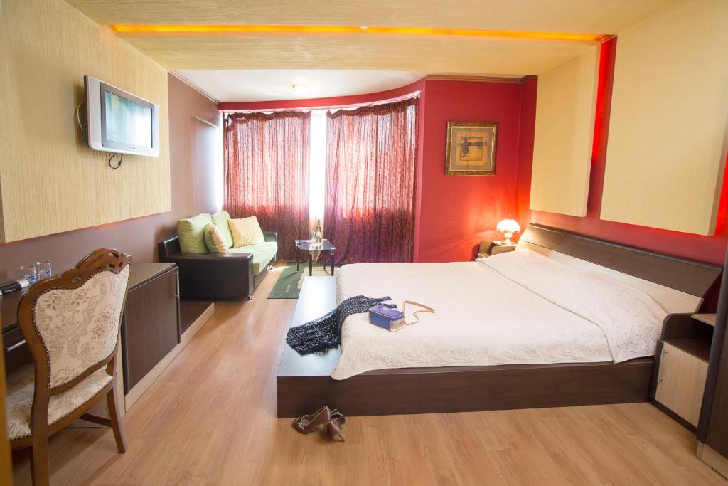 Postel nebo postele na pokoji v ubytování Hotel Gabi