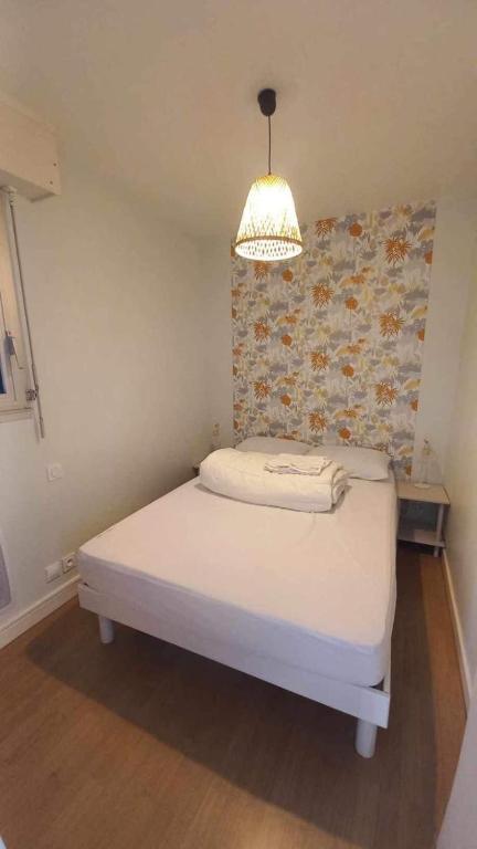 Postel nebo postele na pokoji v ubytování Appartement vue belle iles résidence clipper