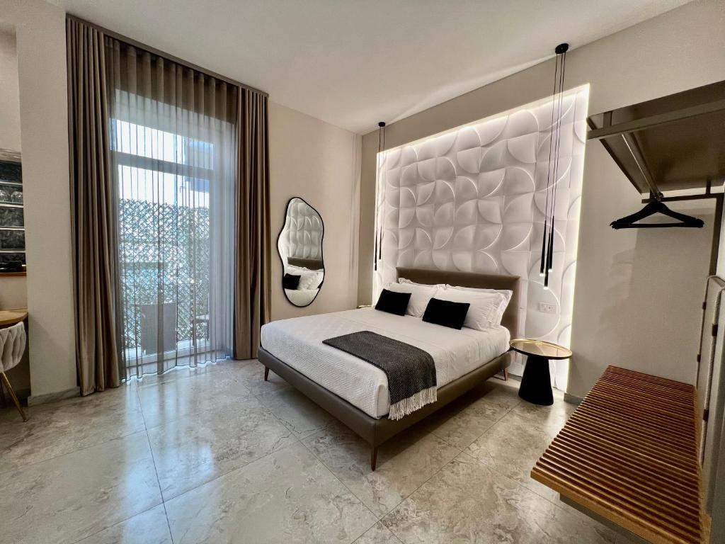 Ένα ή περισσότερα κρεβάτια σε δωμάτιο στο Elegant Rooms