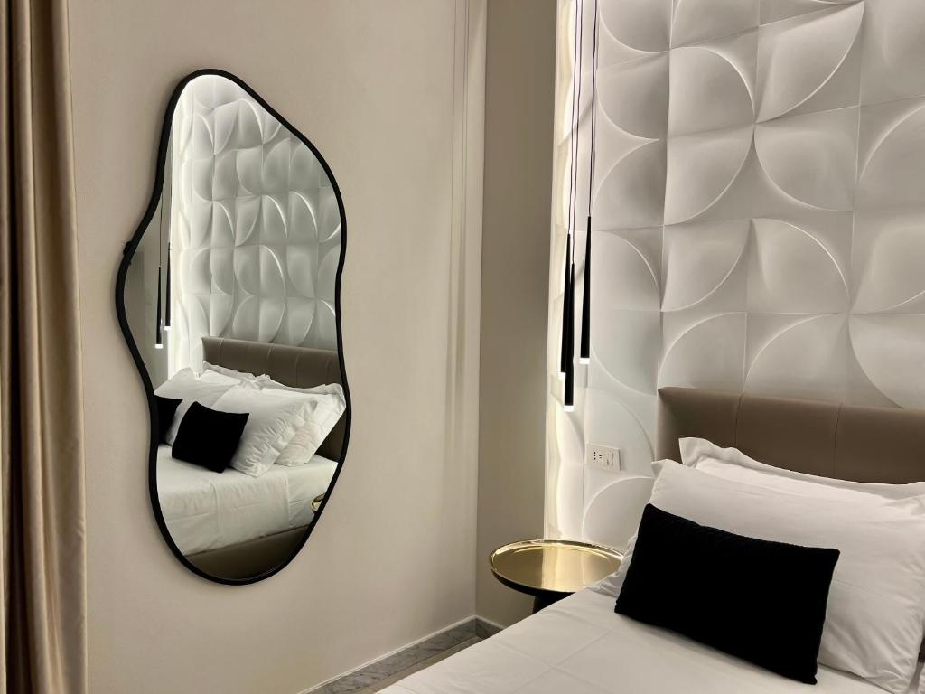 Ένα ή περισσότερα κρεβάτια σε δωμάτιο στο Elegant Rooms