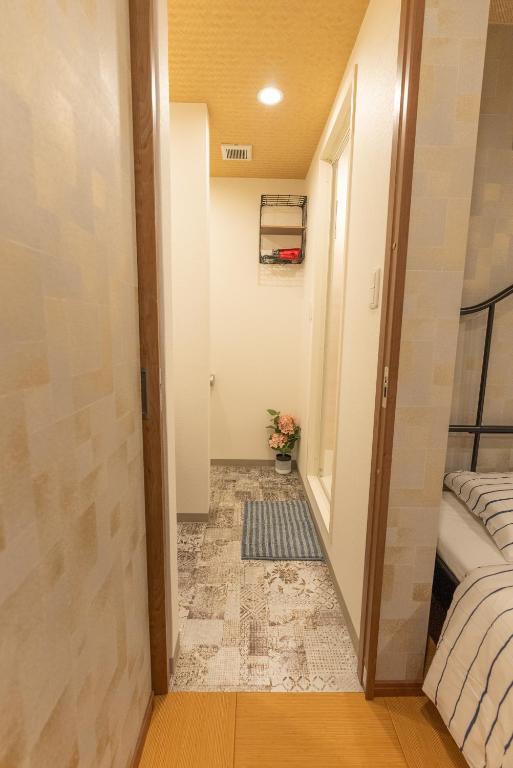 Guest House Kubo Homes Tengachaya 1客房内的一张或多张床位