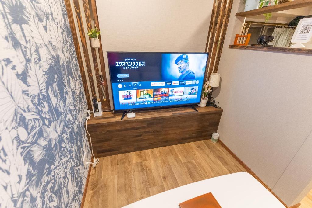 Guest House Kubo Homes Tengachaya 1的电视和/或娱乐中心
