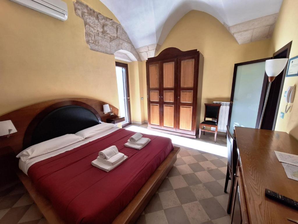 Postel nebo postele na pokoji v ubytování B&B Residenza Pizziniaco