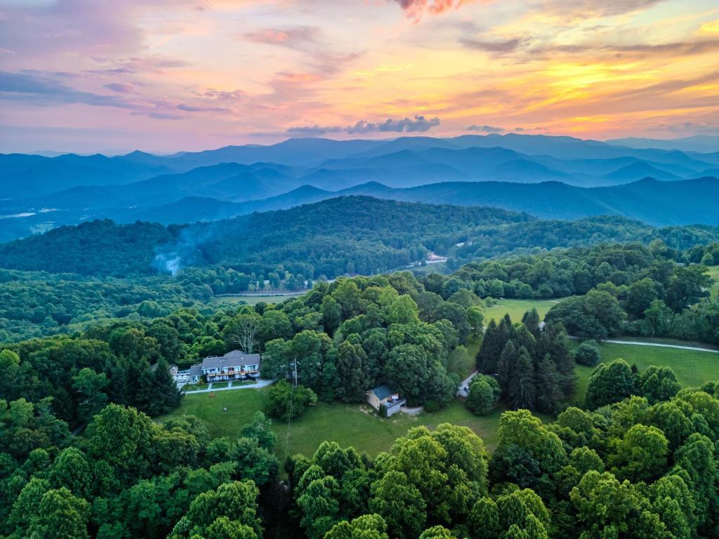 an aerial view of a house in the middle of a forest at Fire Mountain in Highlands