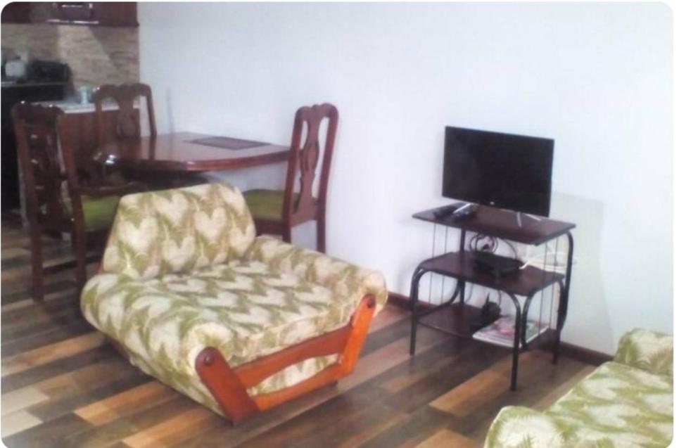 TV a/nebo společenská místnost v ubytování Habitat Apartments
