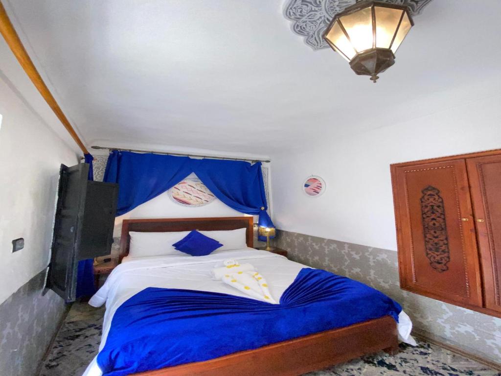 Postel nebo postele na pokoji v ubytování Riad Lazord