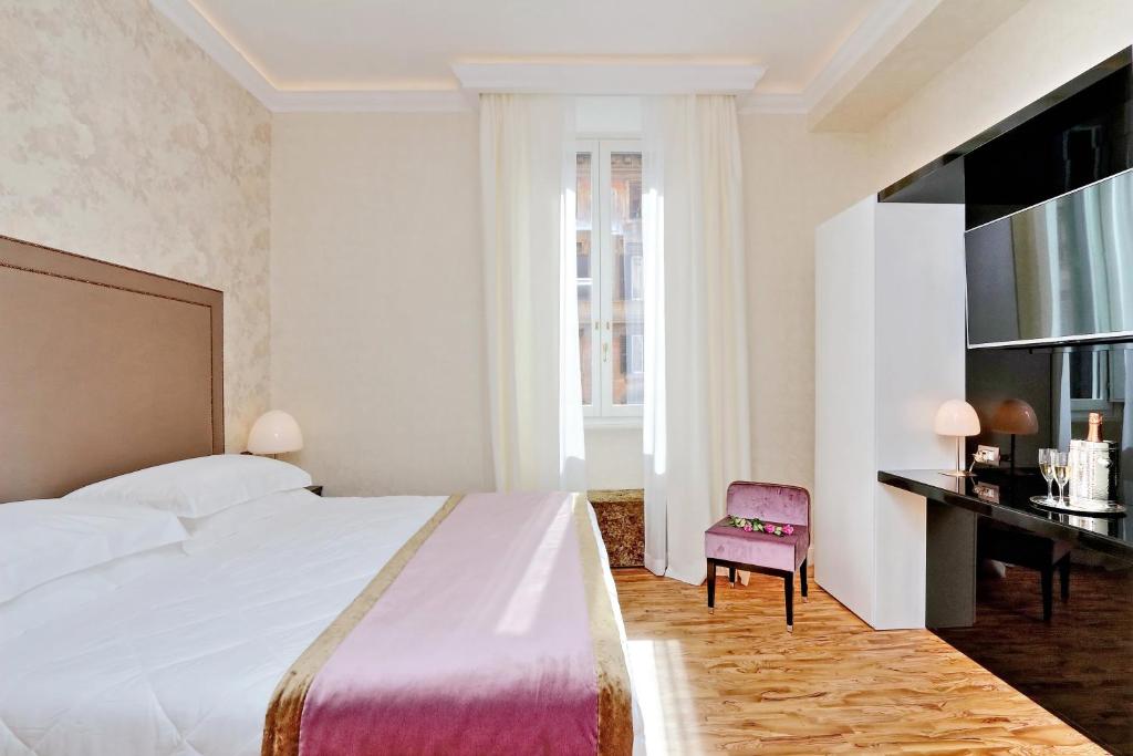 Postel nebo postele na pokoji v ubytování BQ House COLOSSEUM Luxury Rooms