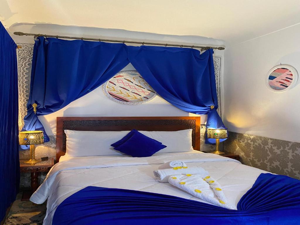 Postel nebo postele na pokoji v ubytování Riad Lazord
