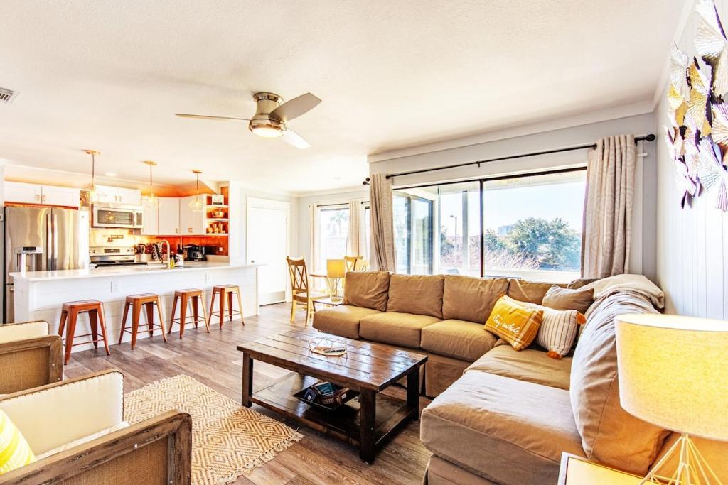 a living room with a couch and a table at Copper Cay Family Friendly Central Location in Destin