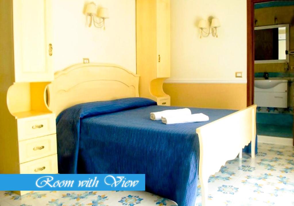 Łóżko lub łóżka w pokoju w obiekcie Bed & Breakfast Medea