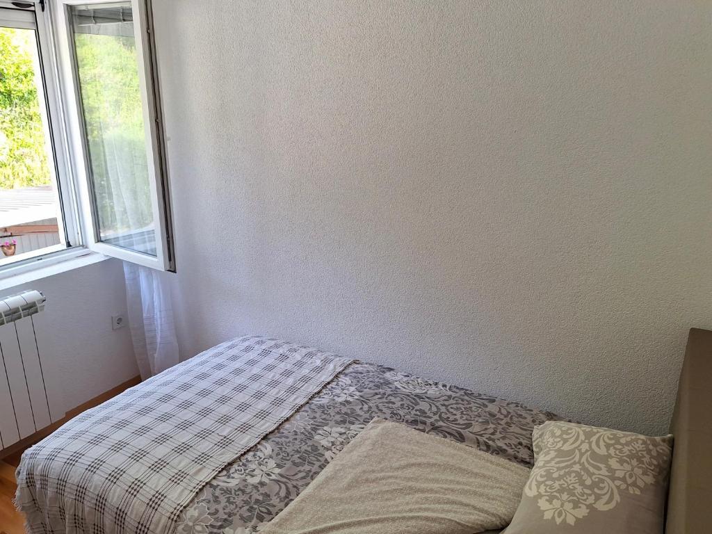 Postel nebo postele na pokoji v ubytování Guest house Adžić