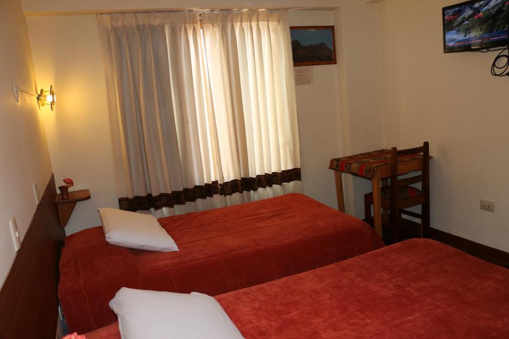Postel nebo postele na pokoji v ubytování Picol Hostal