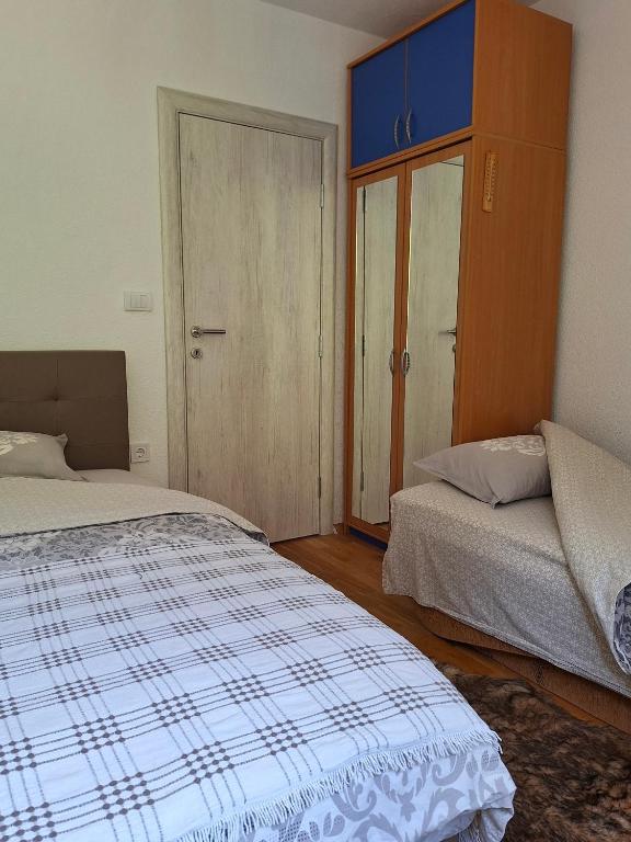 Postel nebo postele na pokoji v ubytování Guest house Adžić