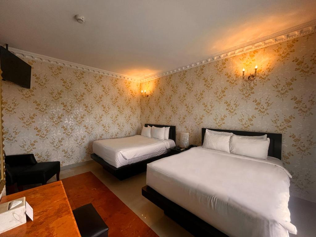Postel nebo postele na pokoji v ubytování Hotel Palacio Maya