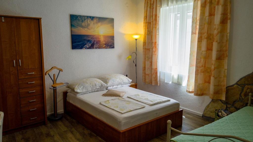 Кровать или кровати в номере Sibenik City Center Apartment