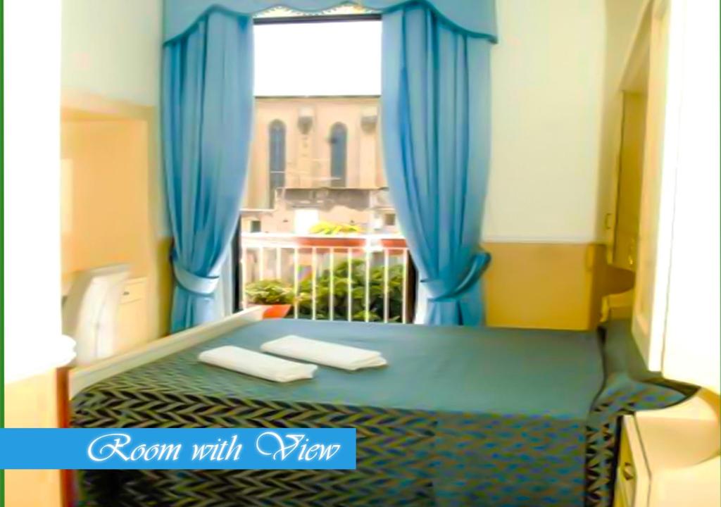 Łóżko lub łóżka w pokoju w obiekcie Bed & Breakfast Medea