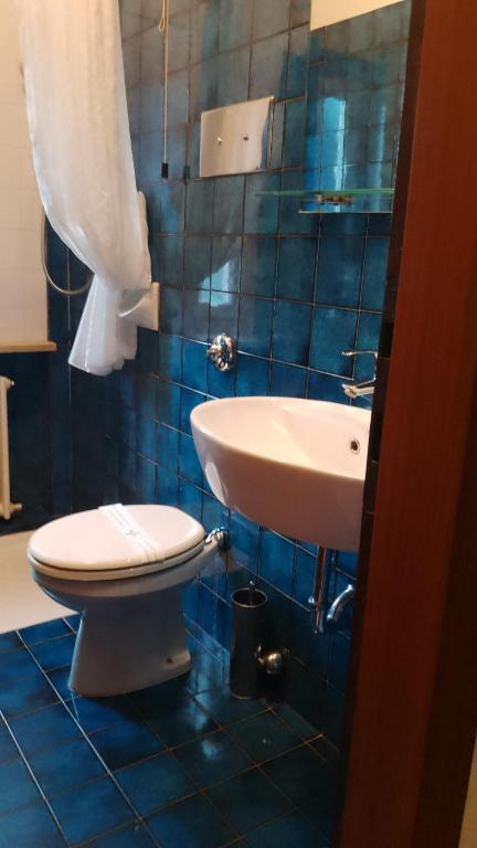 Koupelna v ubytování Hotel Siros