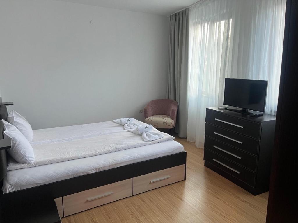 Postel nebo postele na pokoji v ubytování SPA Apartments Perun