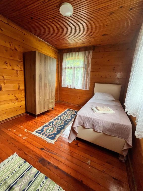 Postel nebo postele na pokoji v ubytování Zenimos Yeşil Doğa Konağı