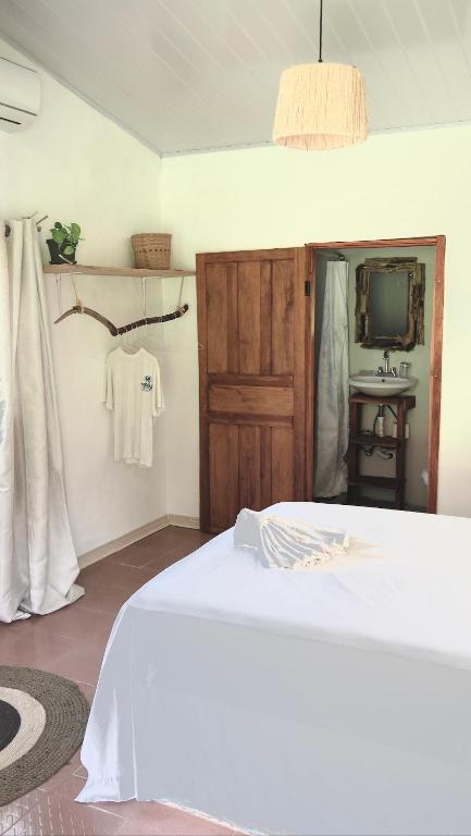 Postel nebo postele na pokoji v ubytování Casa Manila