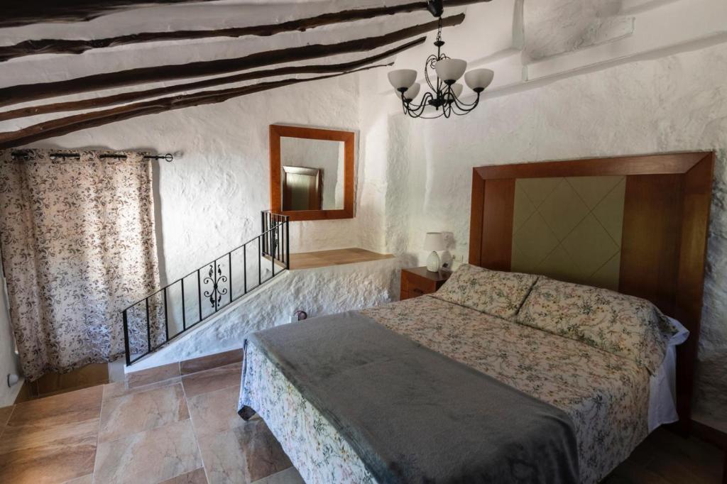 Ένα ή περισσότερα κρεβάτια σε δωμάτιο στο Casitas del Río