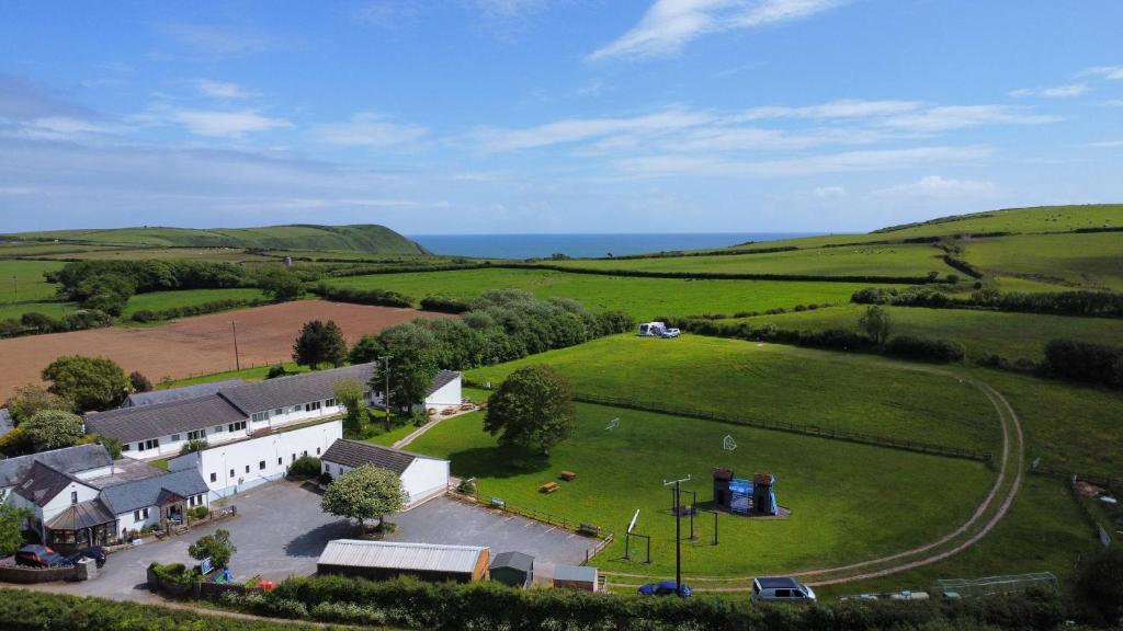an aerial view of a small village in a green field at Coastland Holiday Park in Manorbier