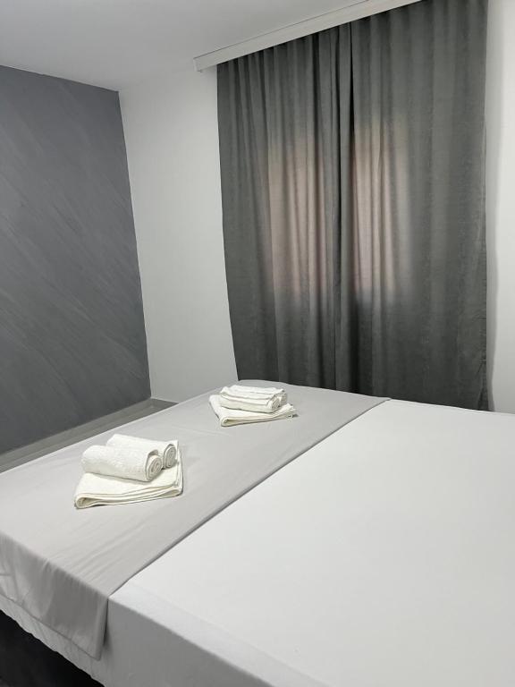 Postel nebo postele na pokoji v ubytování Apartments MASIMO