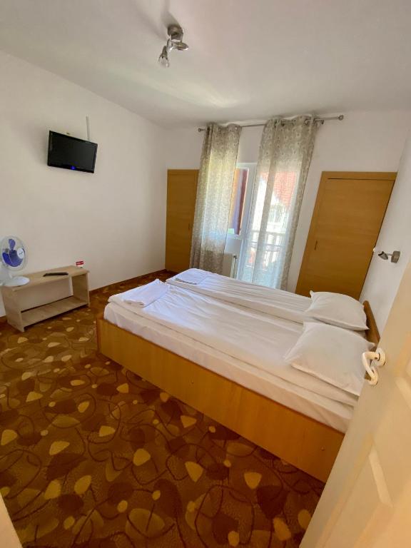 Postel nebo postele na pokoji v ubytování Vila Onix