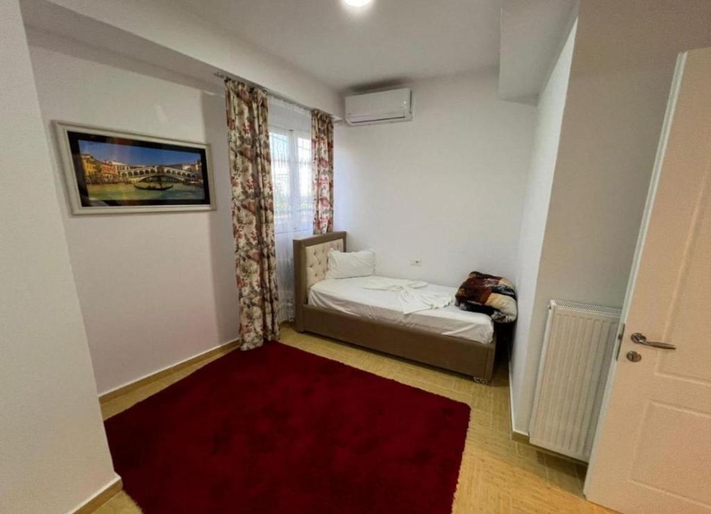 Postel nebo postele na pokoji v ubytování Vila Kasemi