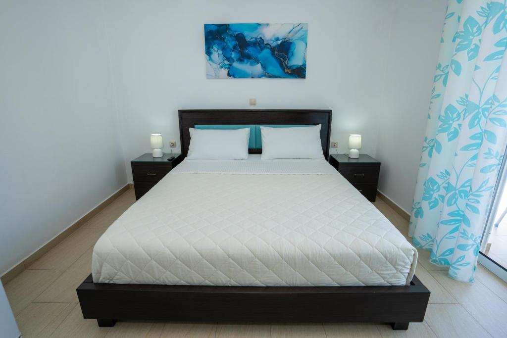 Postel nebo postele na pokoji v ubytování Kalasa Hotel