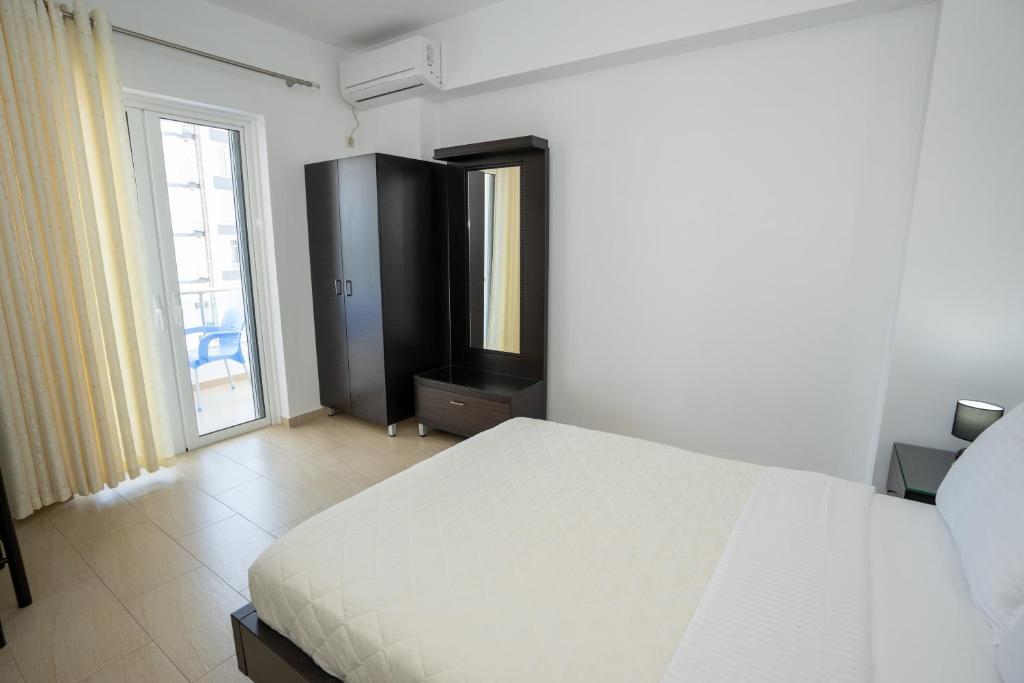 Postel nebo postele na pokoji v ubytování Kalasa Hotel