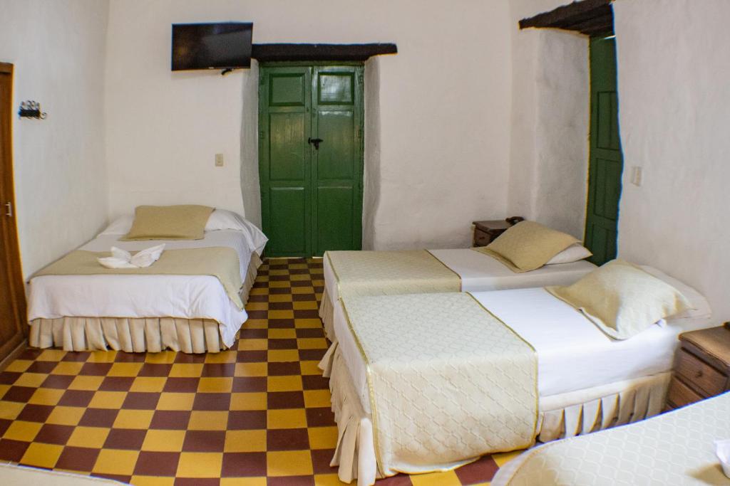 Postel nebo postele na pokoji v ubytování Casa Hotel Guaracú