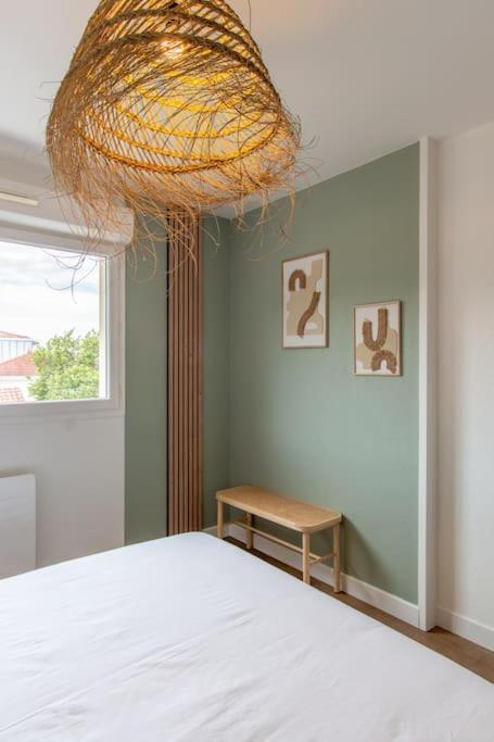 Postel nebo postele na pokoji v ubytování Appartement des grands lacs