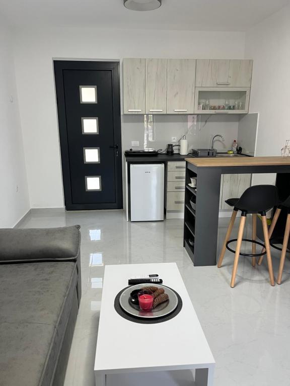 Kuchyň nebo kuchyňský kout v ubytování Apartments MASIMO